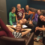 group of teen girls on couches