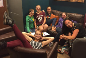 group of teen girls on couches